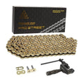 Gold motorcycle chain with master links and chain breaker tool set in box