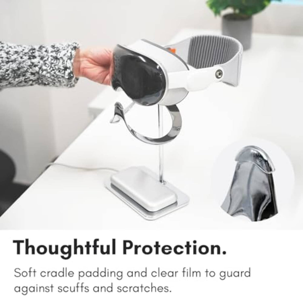Silver stand with soft cradle padding and clear protective film