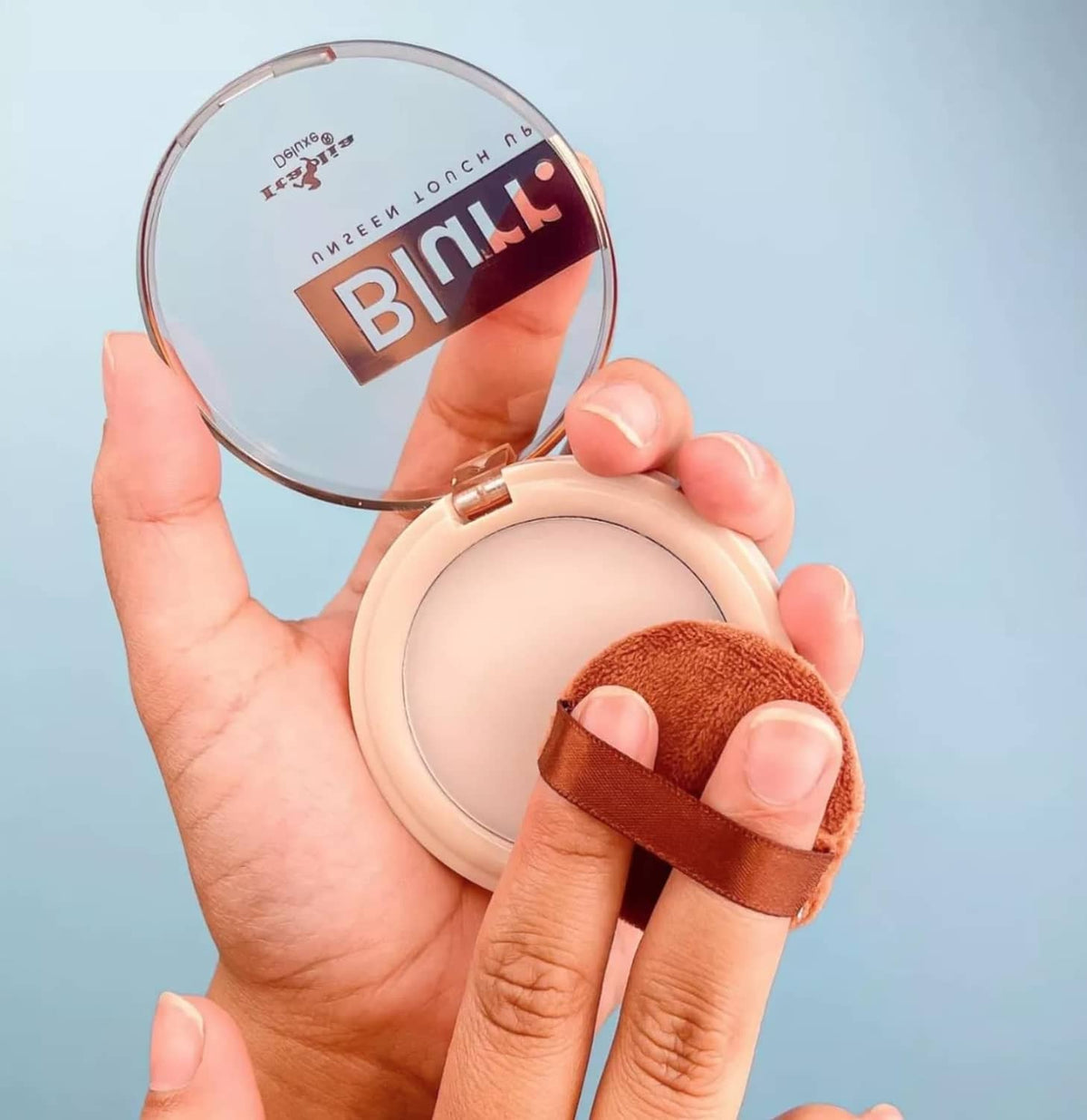 Blurr Unseen Touch Up compact with sponge pad shown, clear finish