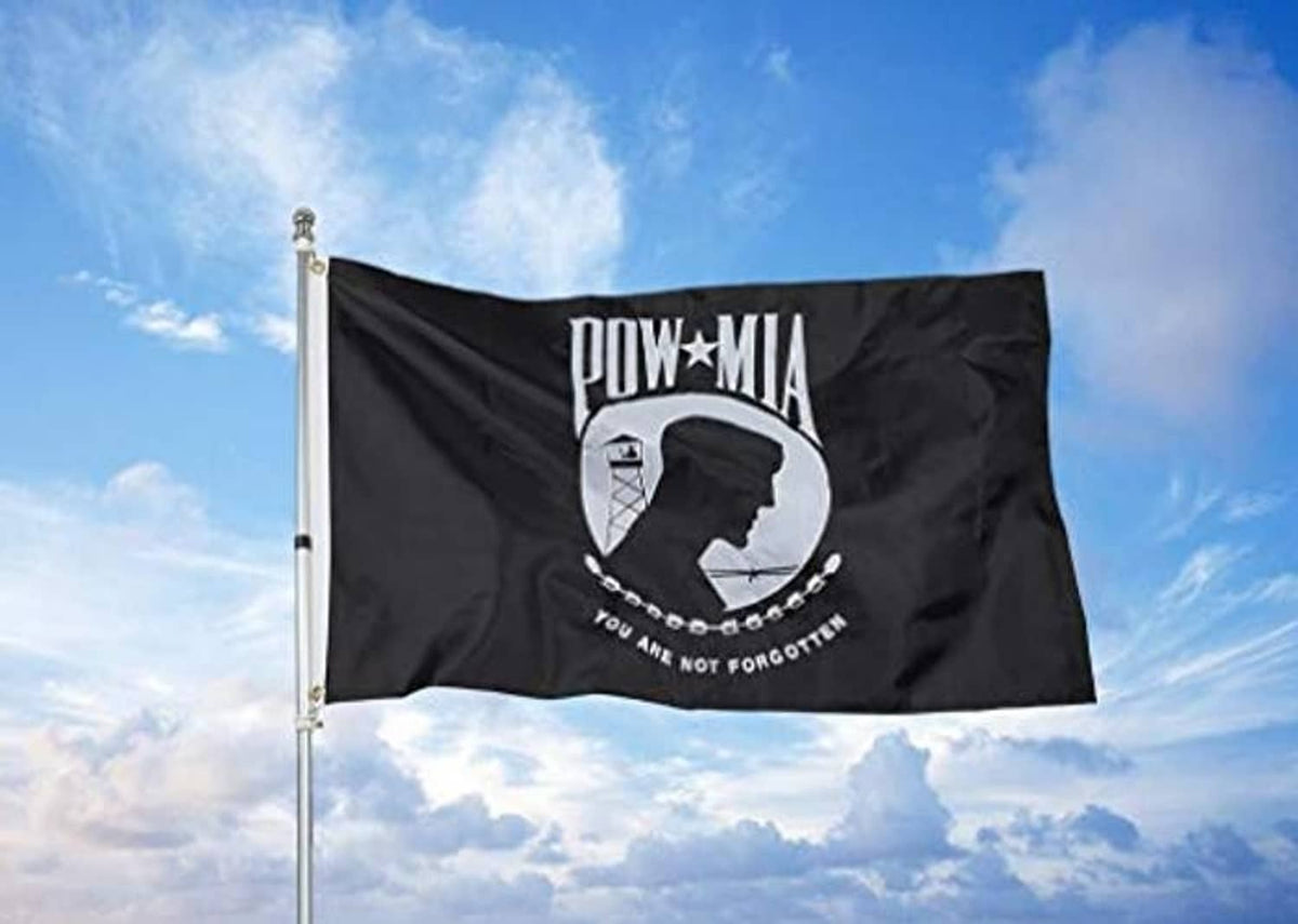 Black POW*MIA outdoor flag flying on a pole, double-sided embroidered design