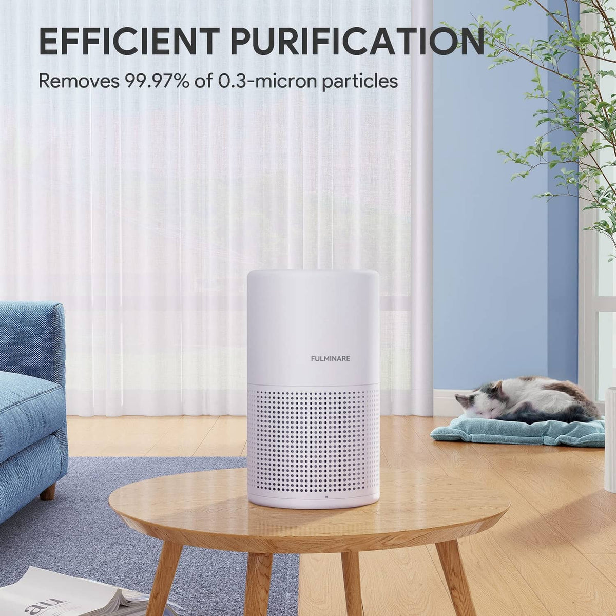 White air purifier on round table with front intake grille and pet resting nearby