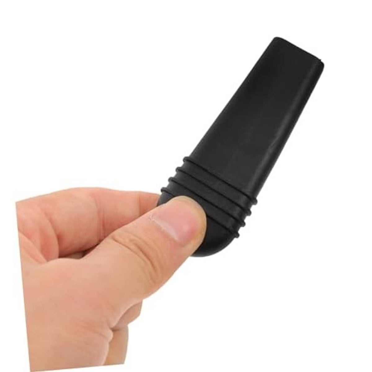Wheelchair brake extension handle cover, black ribbed end cap held by hand