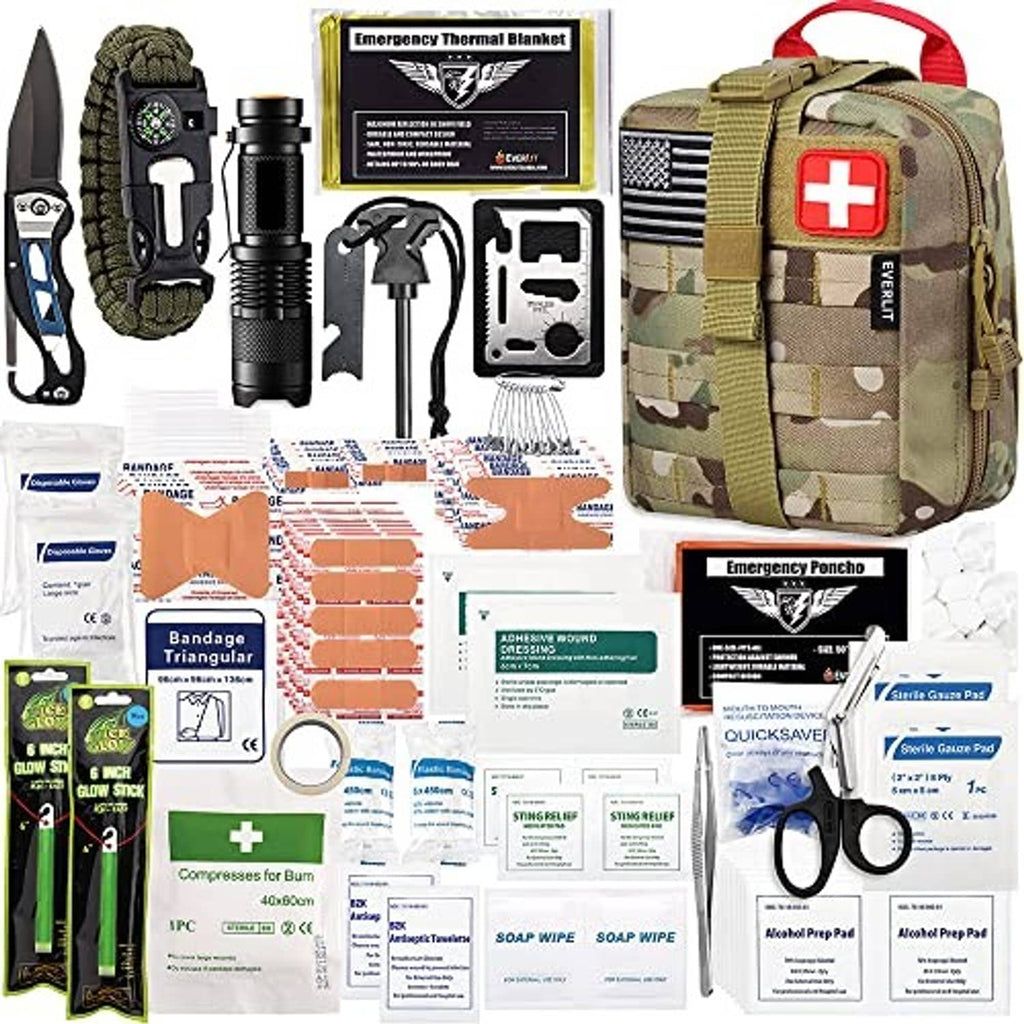 Tactical first aid kit with MOLLE pouch and assorted medical supplies laid out