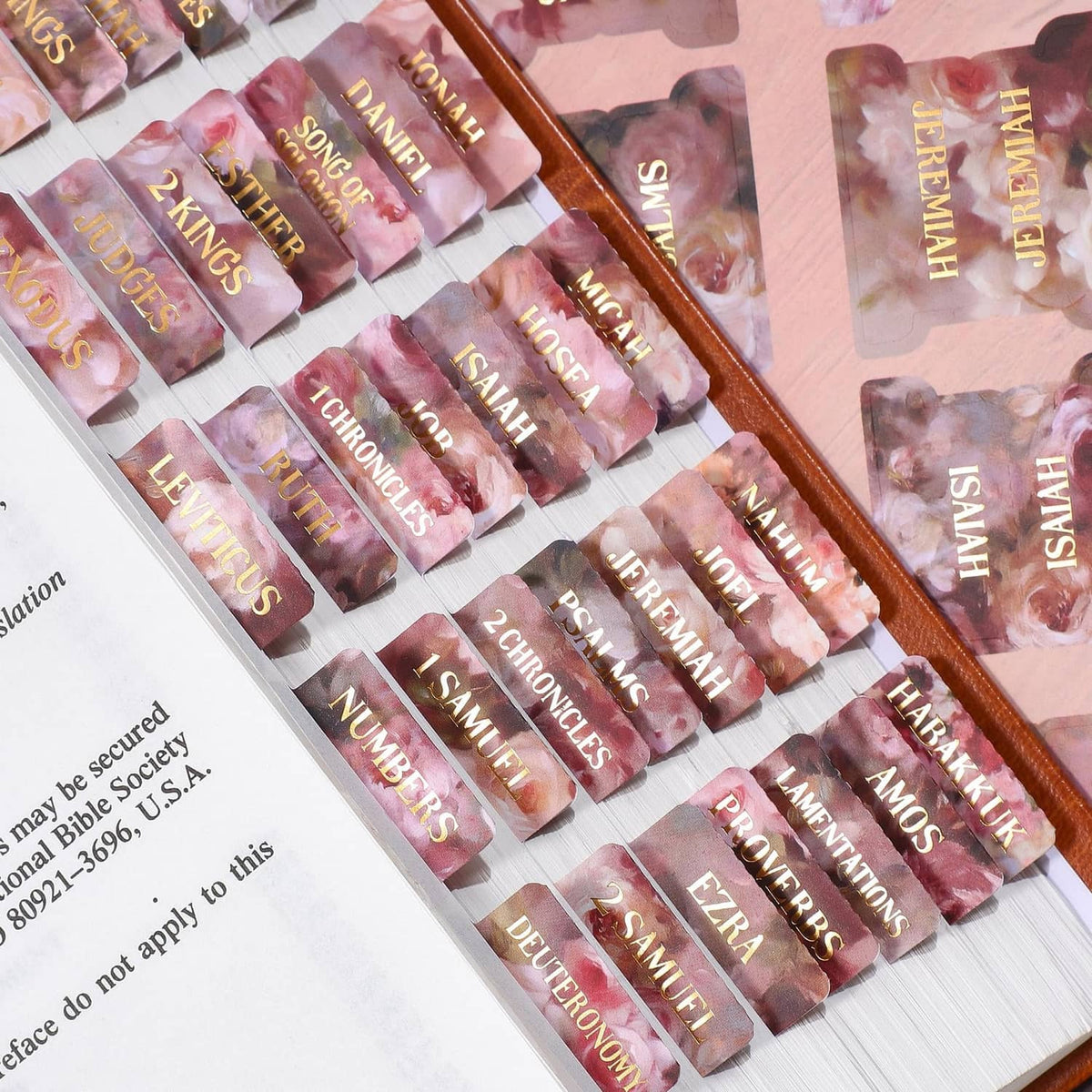 Pink rose floral Bible tab set with gold-foil scripture labels, many index tabs on sheets.