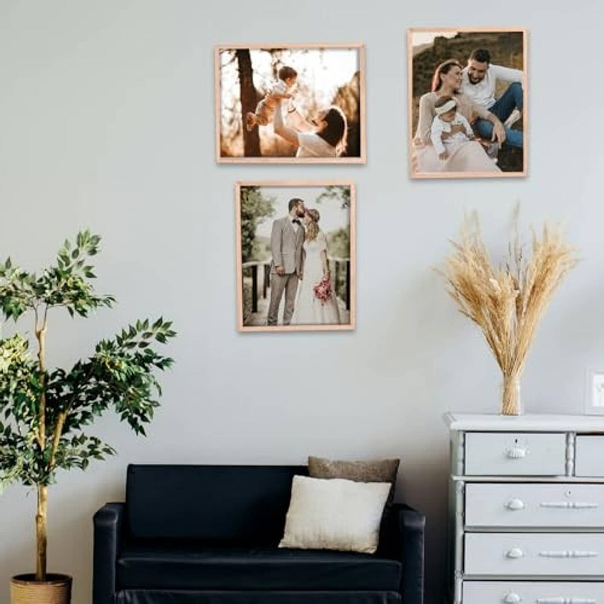 Natural oak 8x10 photo frame set on wall with four family photos