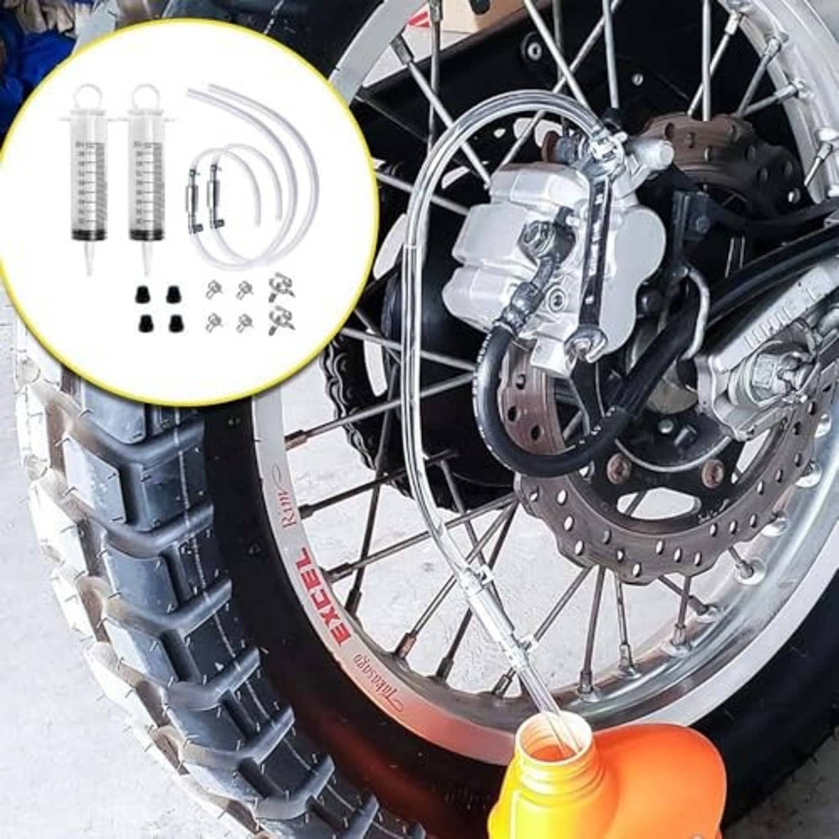 Brake bleeder kit parts set: two syringes, two clear hoses, and metal valve fittings