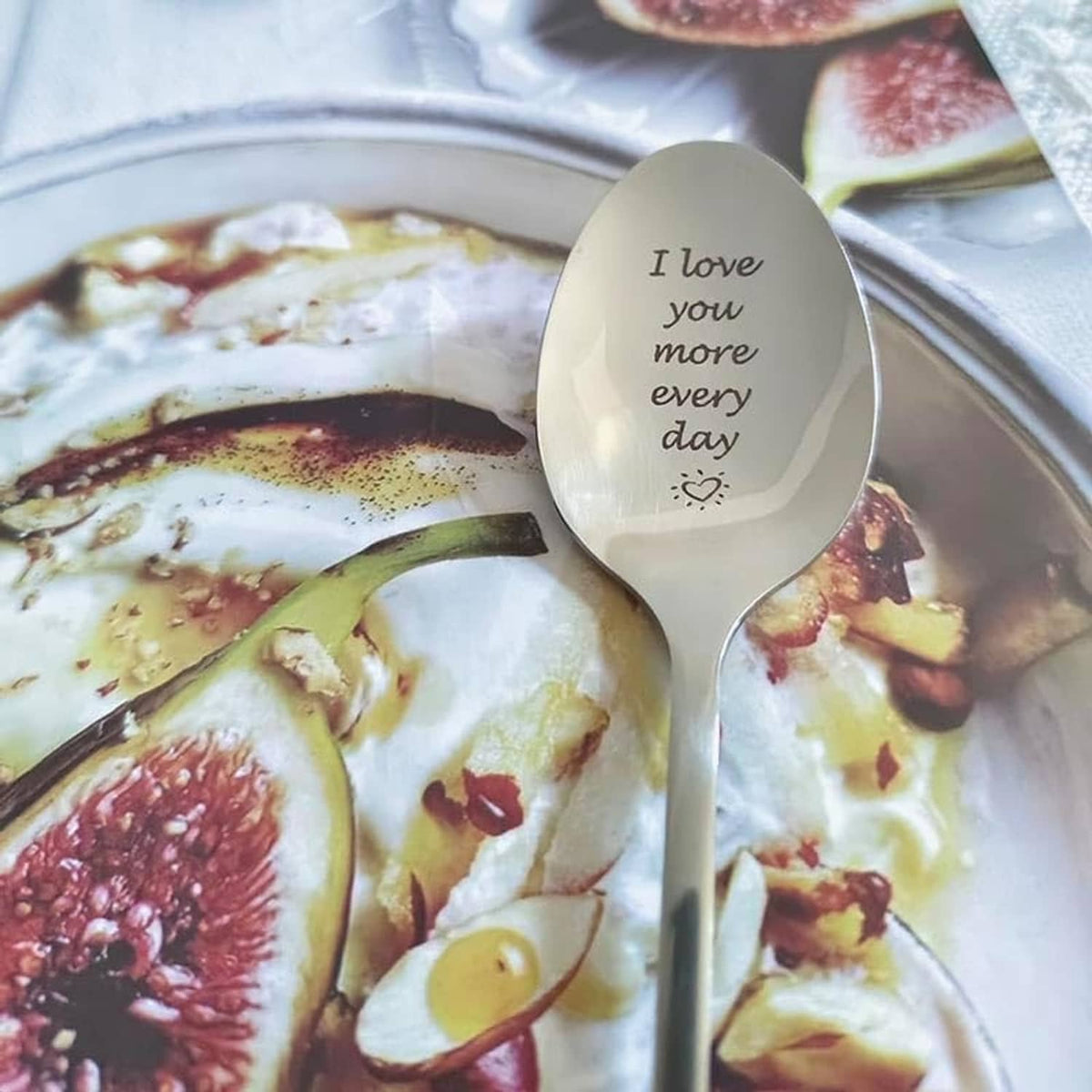 Engraved love message teaspoon with oval beige bowl and silver handle, 'I love you more every day'