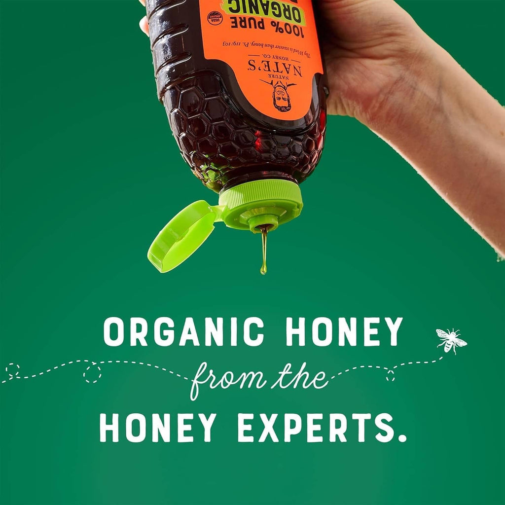 Nate's organic raw honey bottle dispensing a thin honey stream, green cap