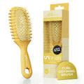 Golden hour curl defining brush with dense white-tipped bristles and grippy handle