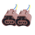 Pair of brown female headlight connector sockets with blue and yellow lead wires