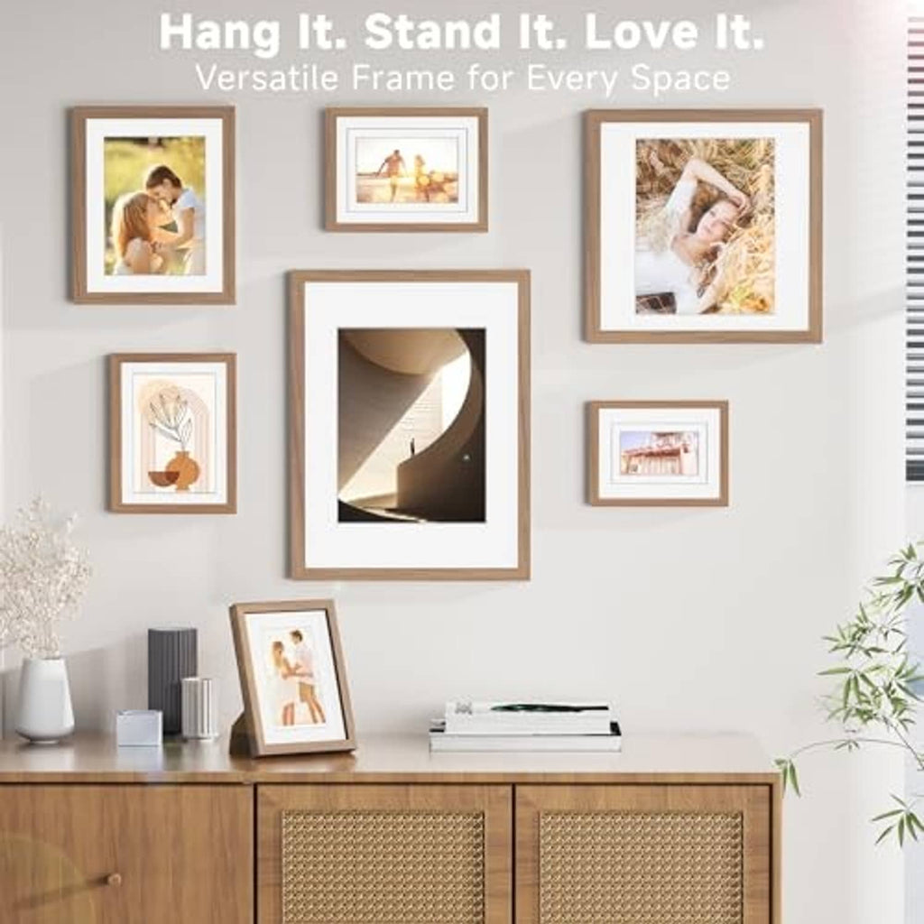 Walnut wood picture frames displayed on wall, with 11x14 frame centered.