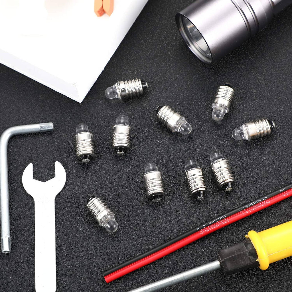 Assorted mini E10 LED flashlight bulbs with clear lens and silver screw bases