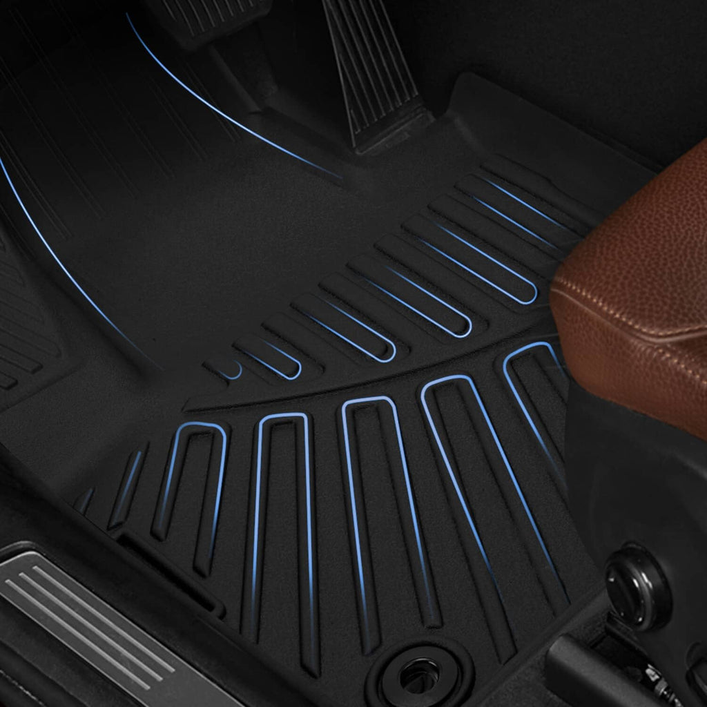 Black floor liner mat surface with blue traction ridges and raised drainage grooves