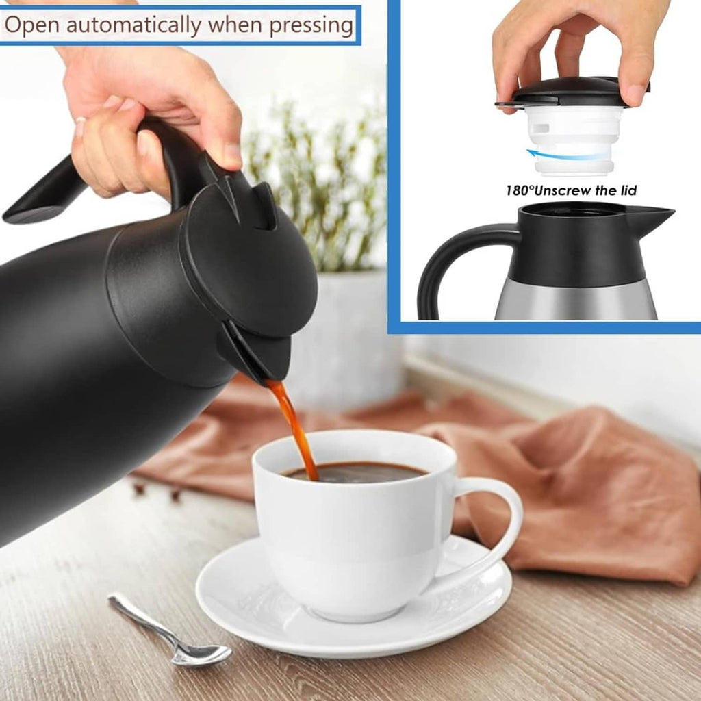Black insulated carafe lid opening and pouring spout over a cup