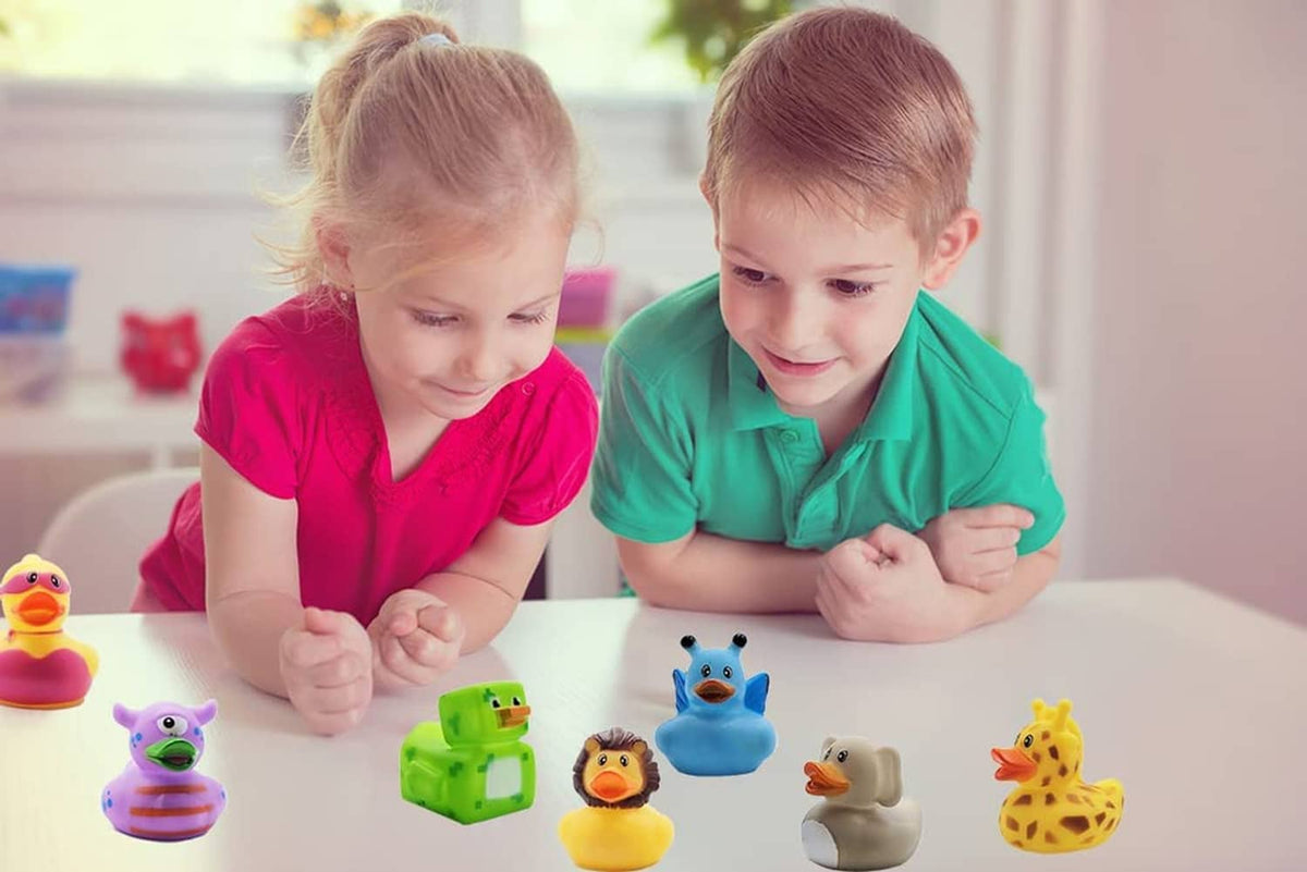 Children playing with assorted rubber duck toys on a table, multiple duck figures visible