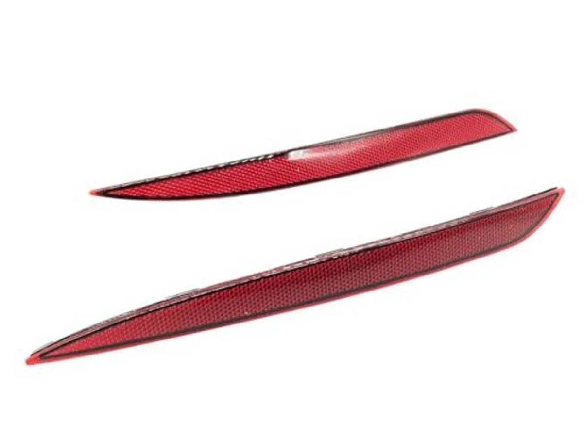 Two red textured reflector lens inserts for rear bumper side marker lights