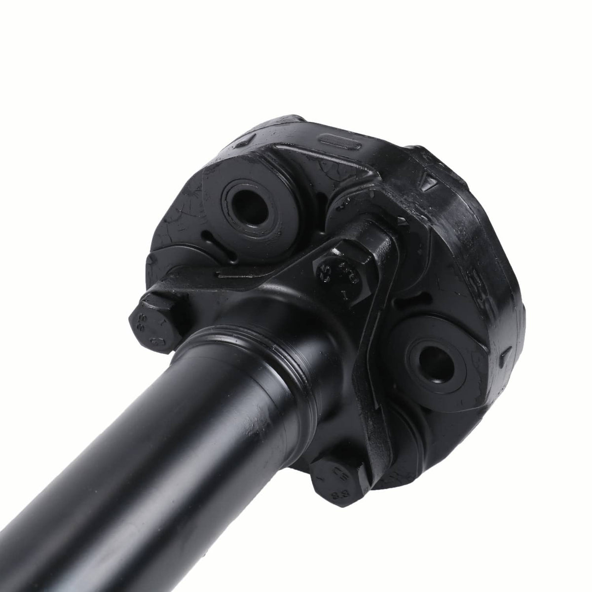 Front drive shaft U-joint yoke with mounting holes, black metal close-up