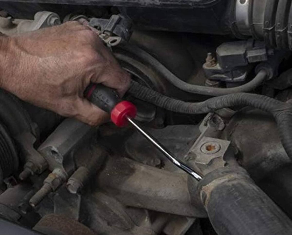 Radiator hose spoon tool with long metal rod and red-black grip used on engine bay