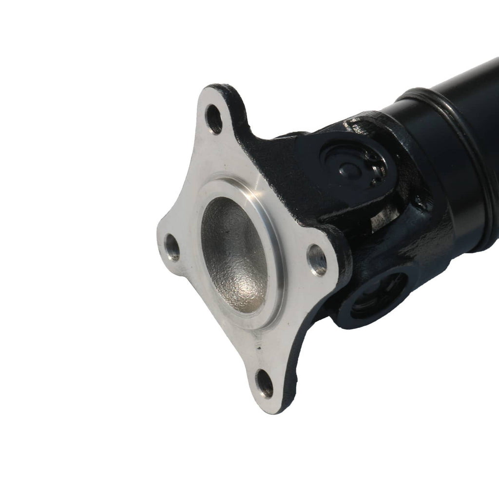 Driveshaft mounting flange with metal bolt pattern and black joint housing.