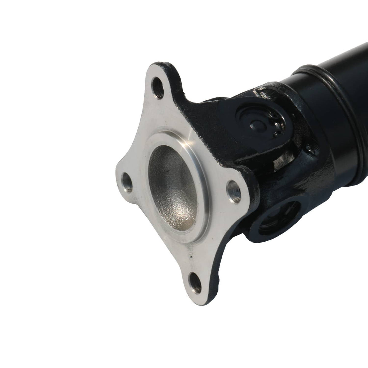 Driveshaft mounting flange with metal bolt pattern and black joint housing.