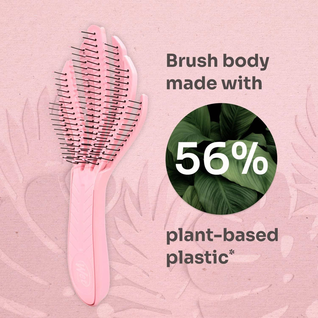 Pale pink brush body with dense pin bristles for detangling curls