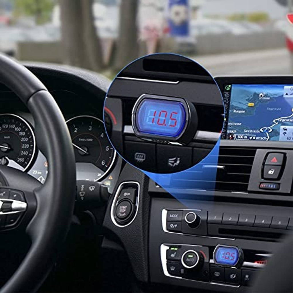 Digital car voltmeter mounted on dashboard with blue LED screen and red voltage digits