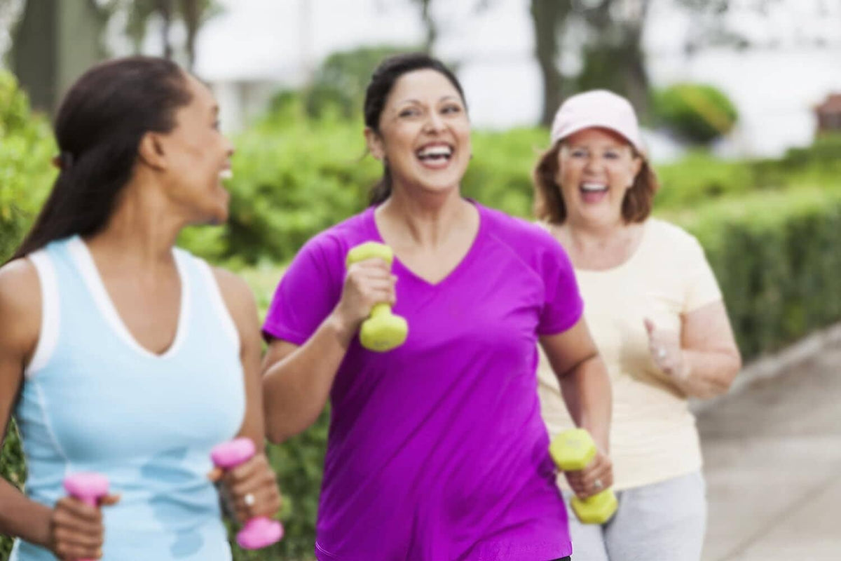 Bari Liquid Force multivitamin lifestyle scene: three women jogging with colorful handheld weights