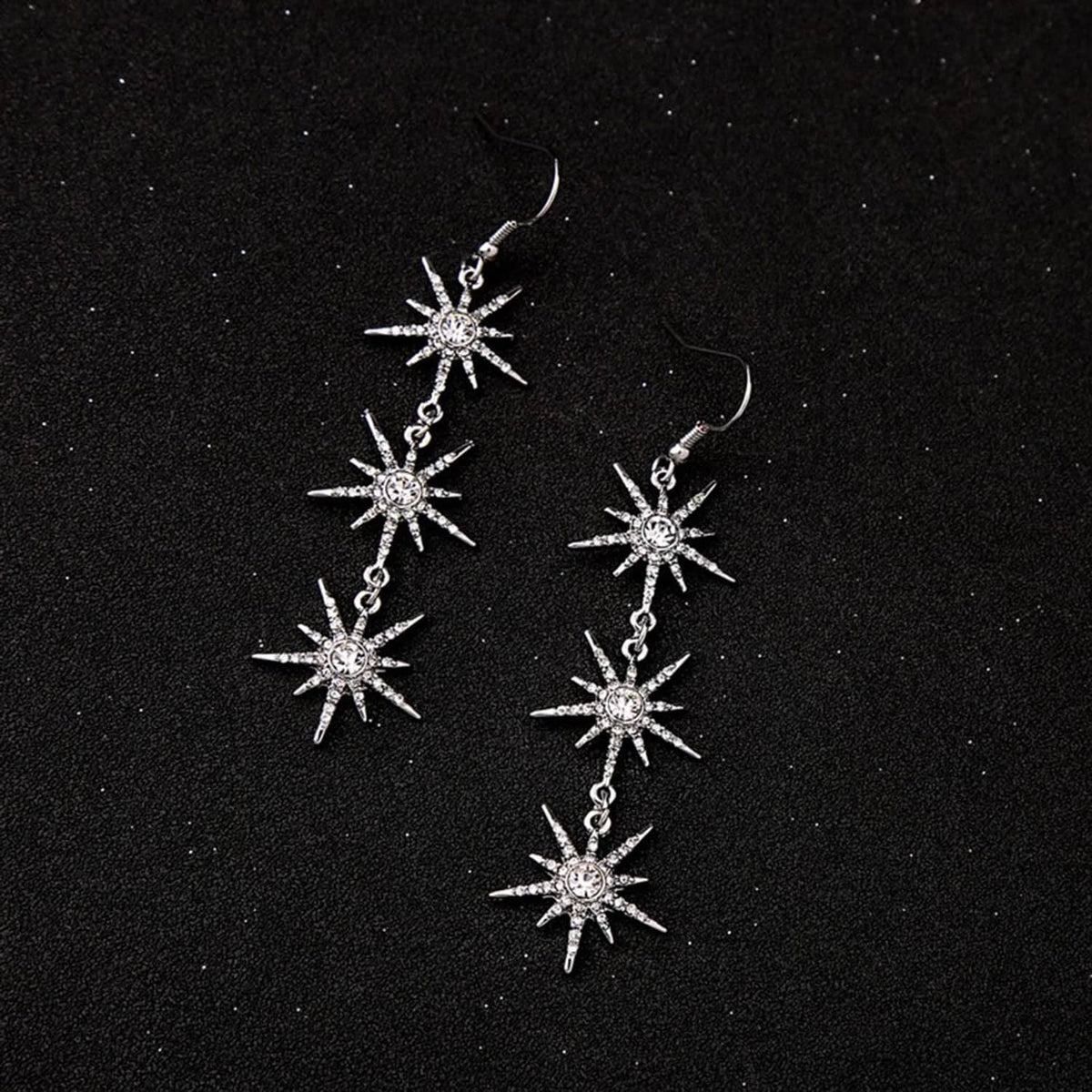 Snowflake dangle earrings, silver-toned with three dangling crystal snowflakes per earring