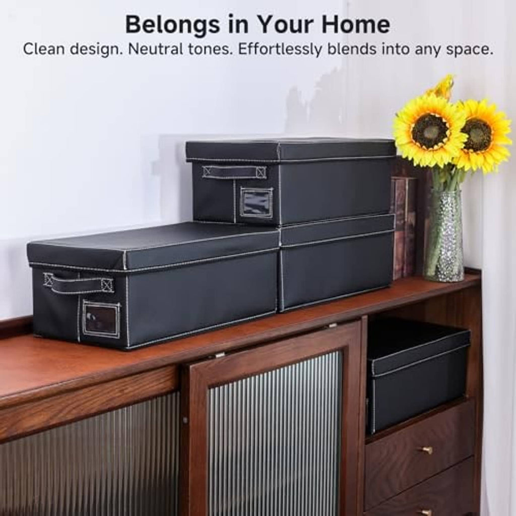 Black faux leather DVD storage boxes with lids, stacked for shelf storage