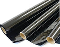 Window tint film roll, dark smoke gray sheet with glossy surface and protective backing.