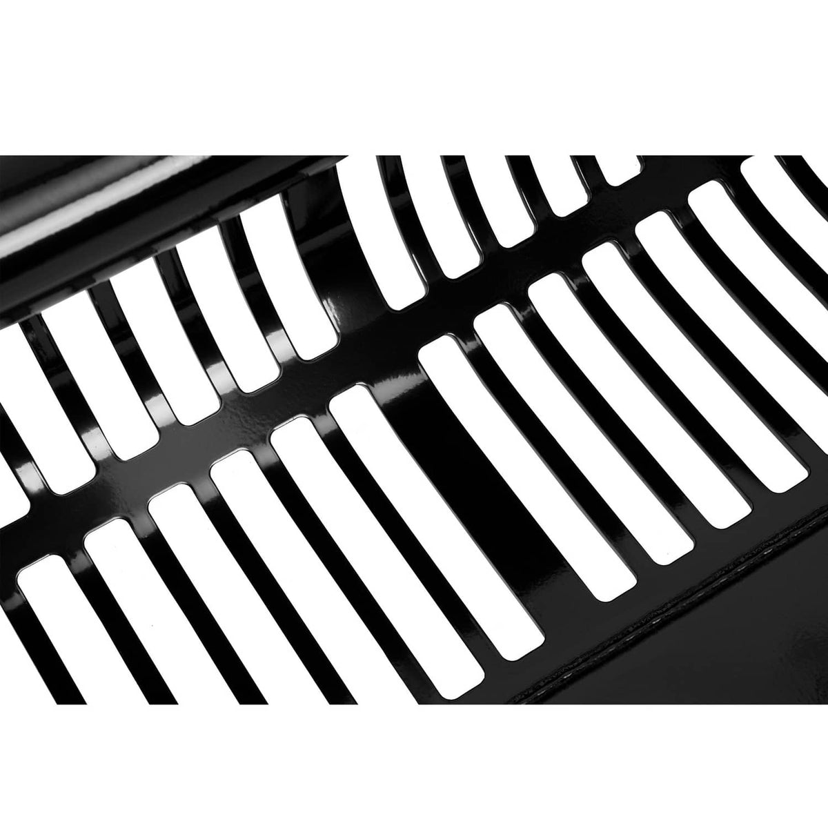 Close-up of black screening grid with repeating curved bar openings