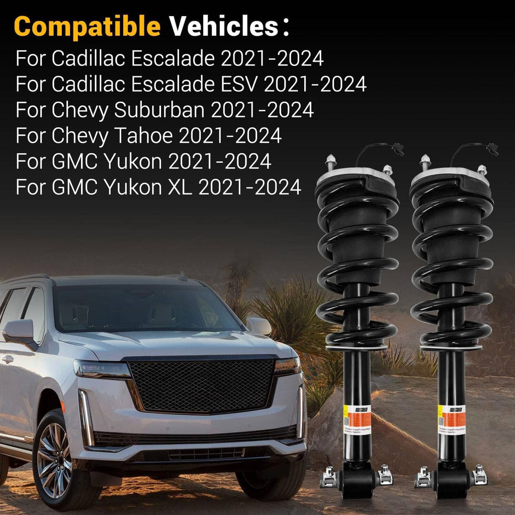 Two black shock absorber struts with coil springs and bottom mounts