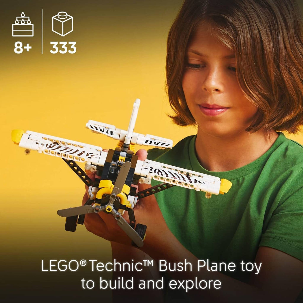 LEGO Technic bush plane toy in a child’s hands, white and yellow airplane