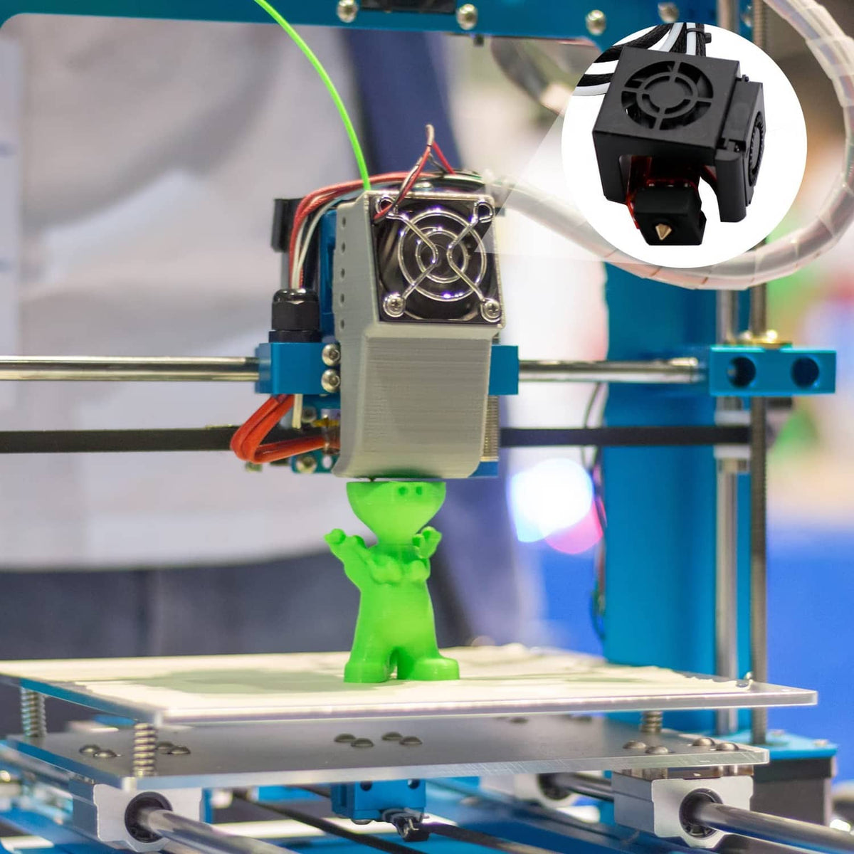 3D printer extruder assembly with black silicone heater block cover installed on hotend