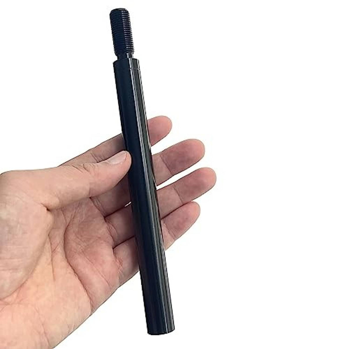 Black 6-inch shift knob extender held in hand, threaded top end