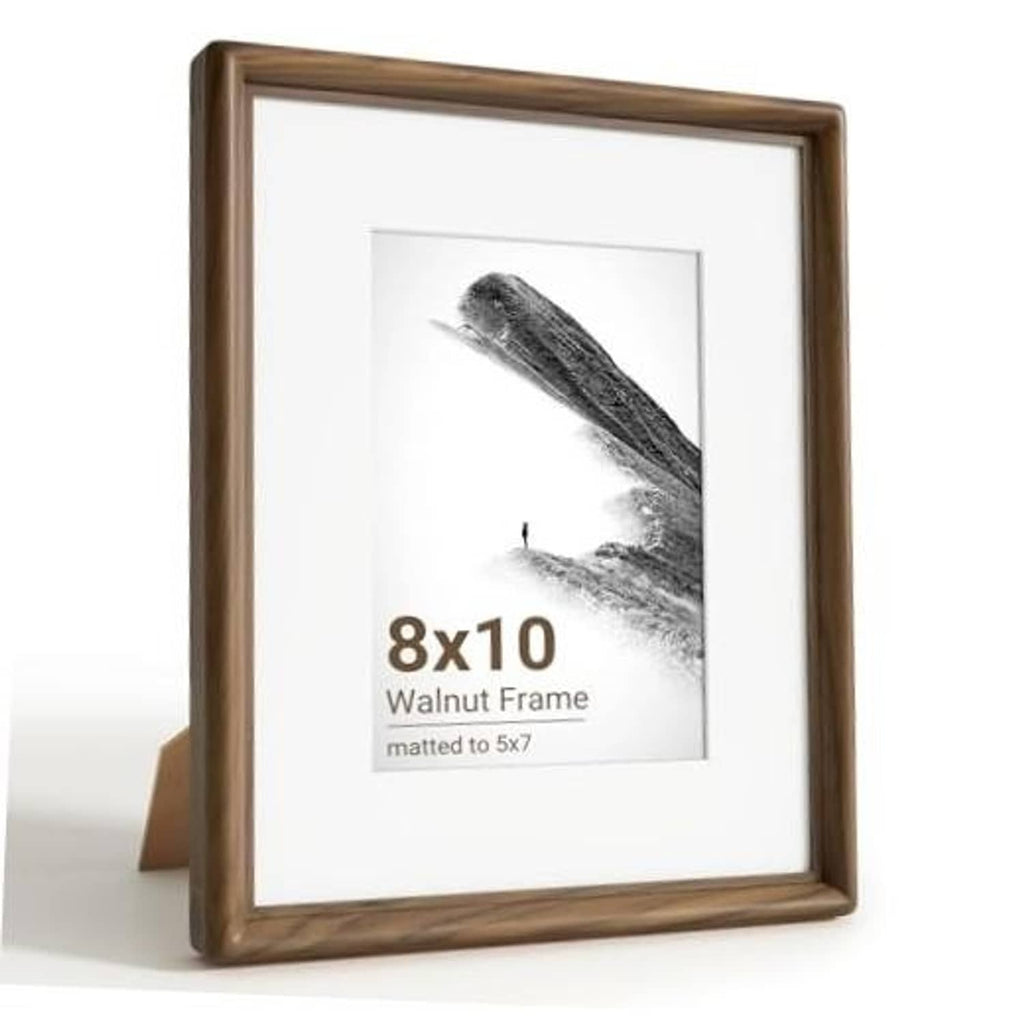 Walnut wood 8x10 picture frame with white mat and glass, shown on a standing easel