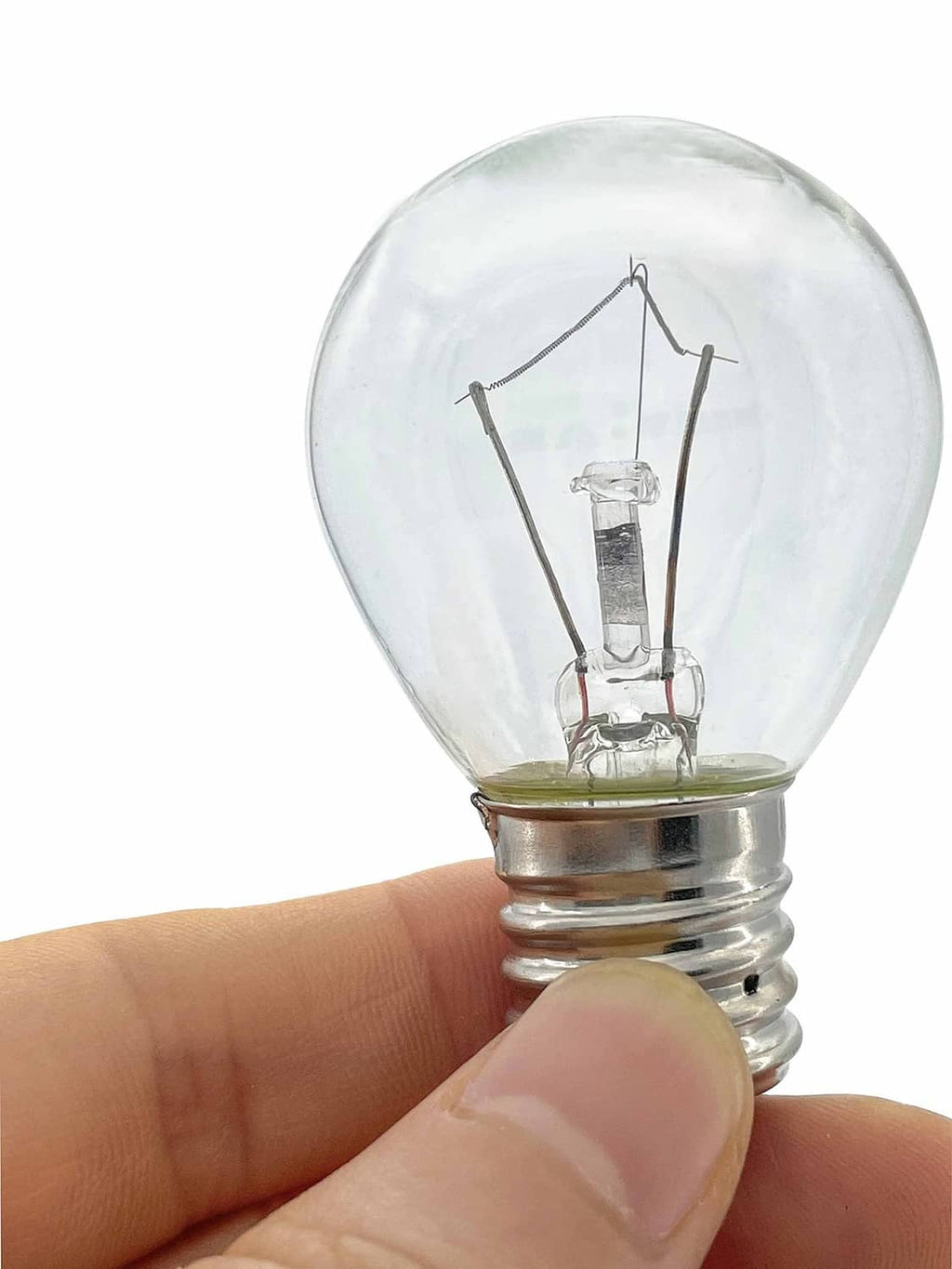 Clear lava lamp bulb held in fingers, showing filament and metal screw base