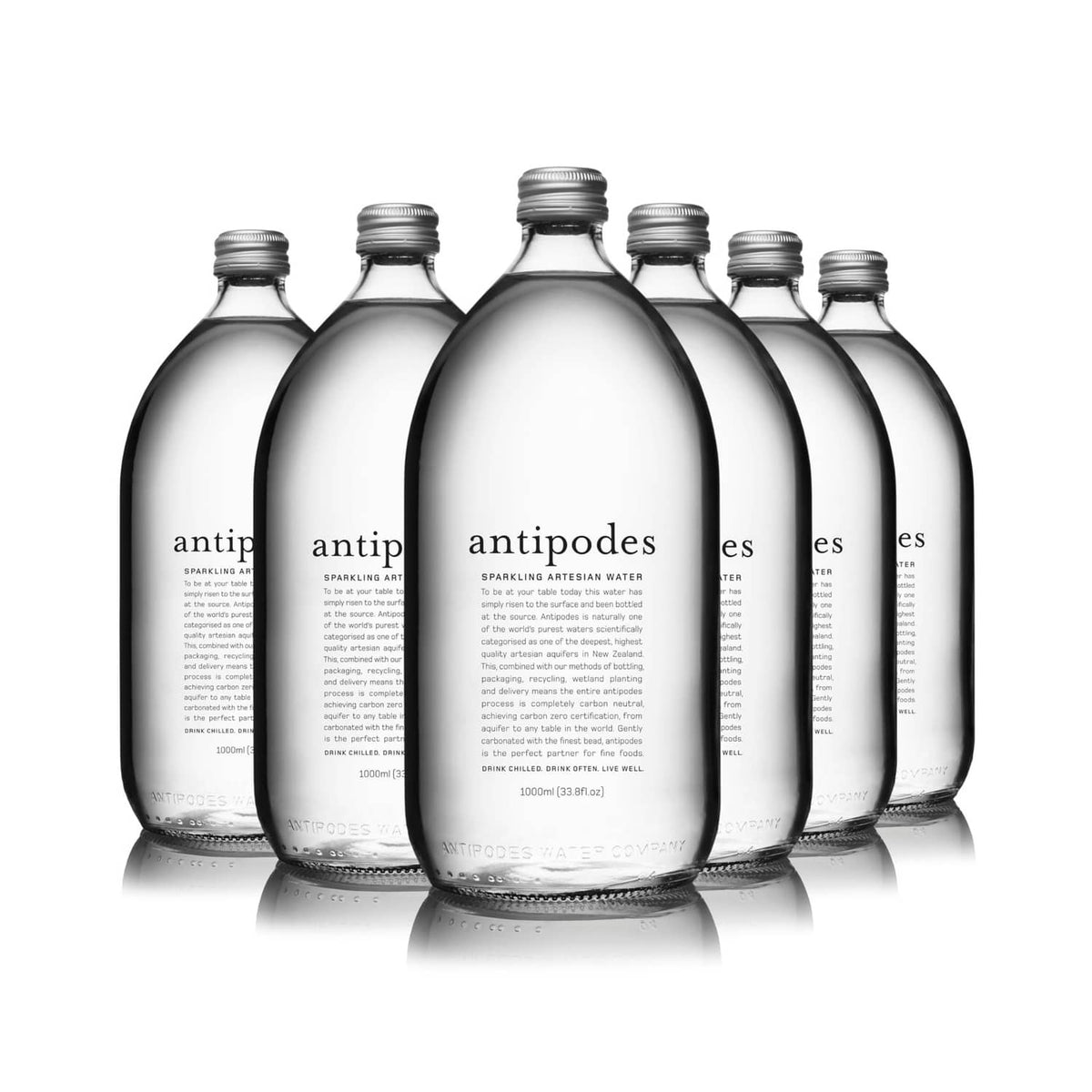 Six Antipodes sparkling artesian water glass bottles, dark tint, front view