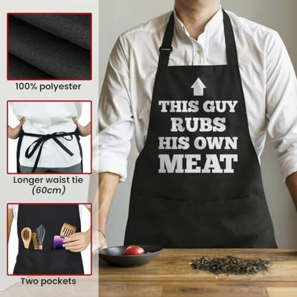 Black polyester apron with two front pockets and 'THIS GUY RUBS HIS OWN MEAT' print
