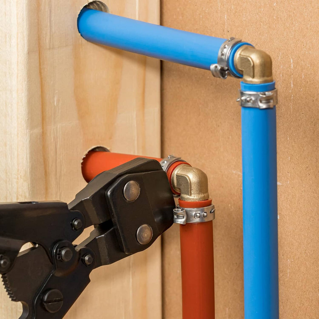 Silver double-ear hose clamp securing a hose on a plumbing pipe