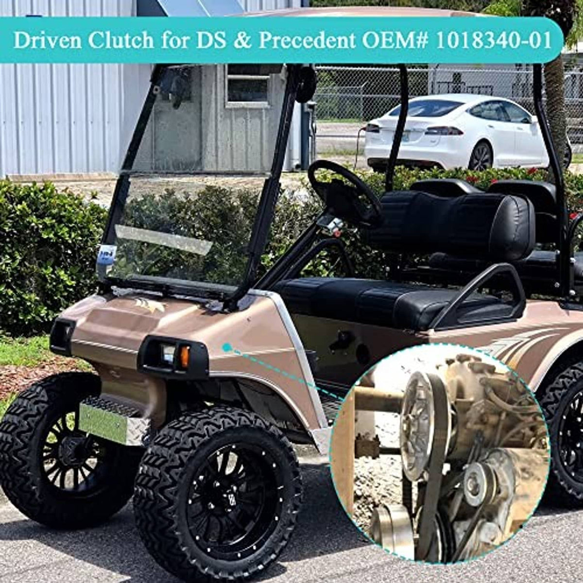 Golf cart drivetrain view with a large pulley wheel and mounted driven clutch