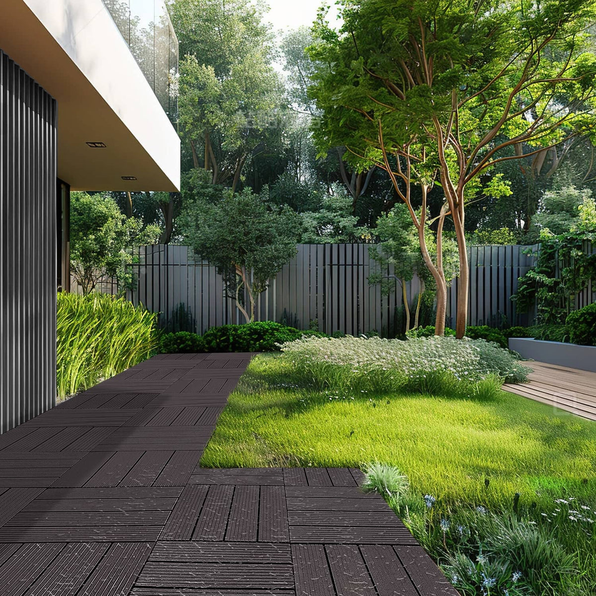 Interlocking deck tile walkway in dark brown on a garden lawn