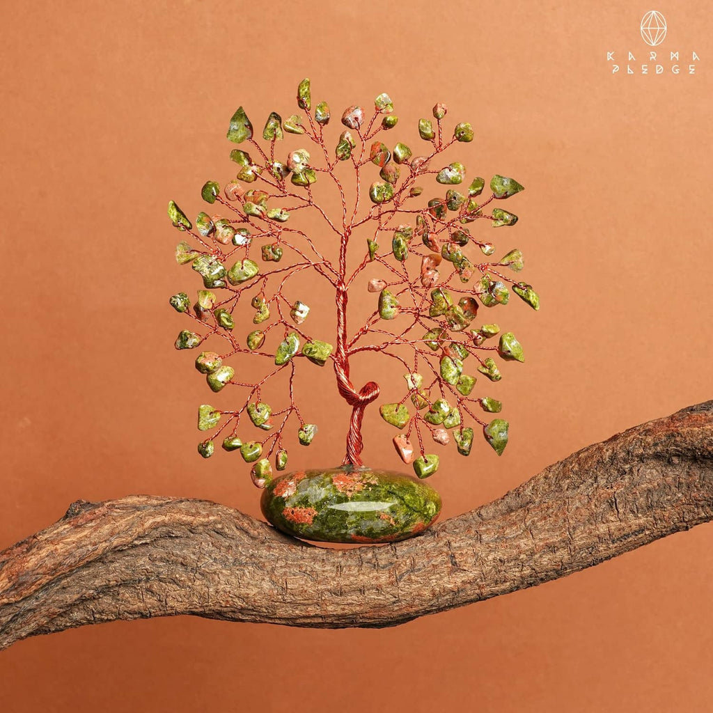 Unakite stone tree ornament on wood slab, red wire branches and green-orange base