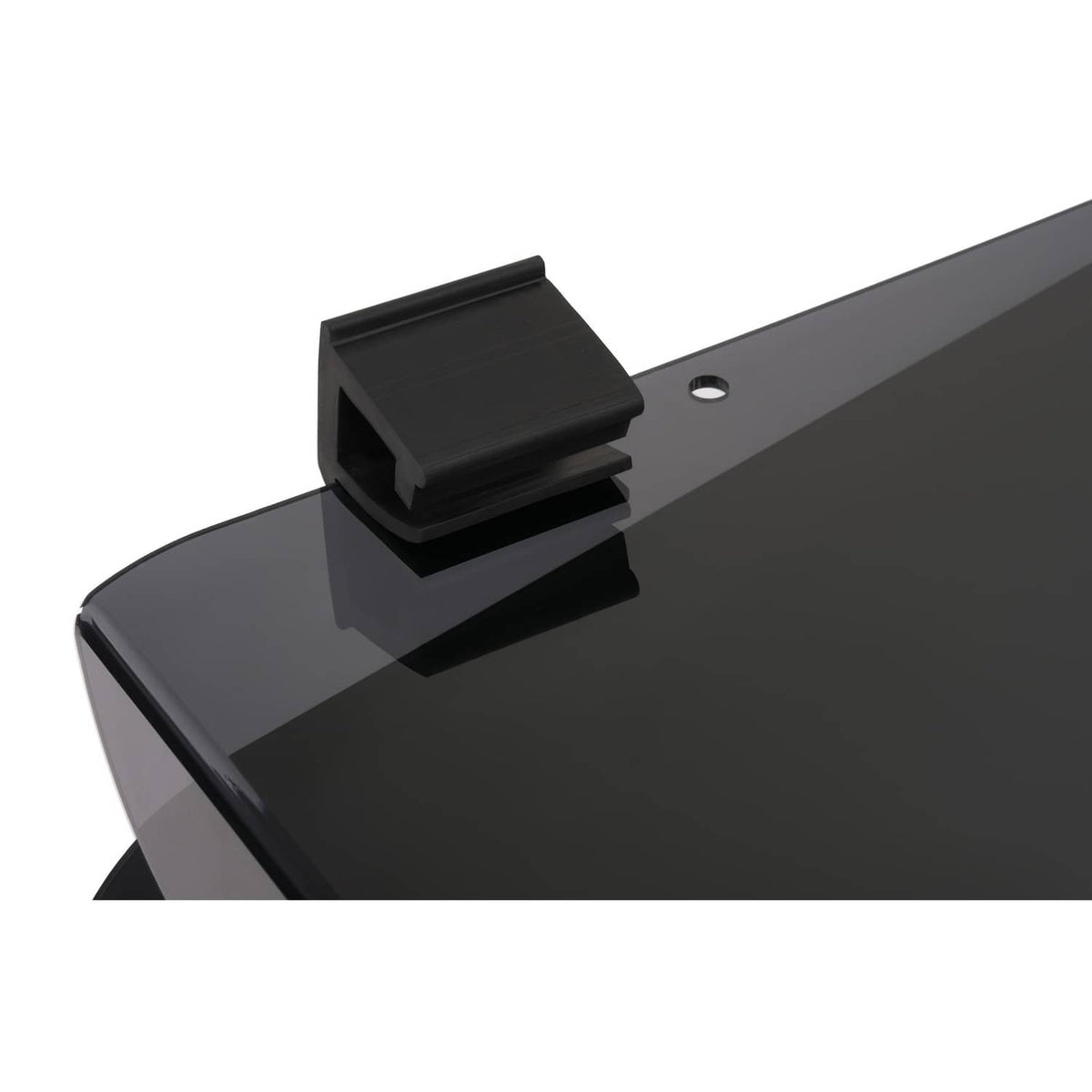 Tinted windshield panel with black latch tab near side mounting holes