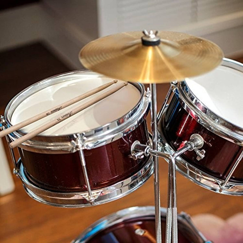 Maple wood drumsticks resting on a snare drum