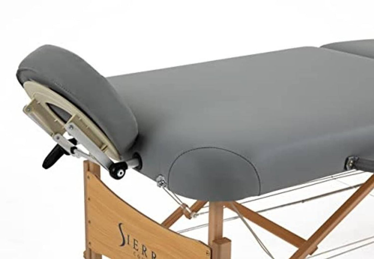 Gray padded massage table with adjustable hardware on wooden folding frame