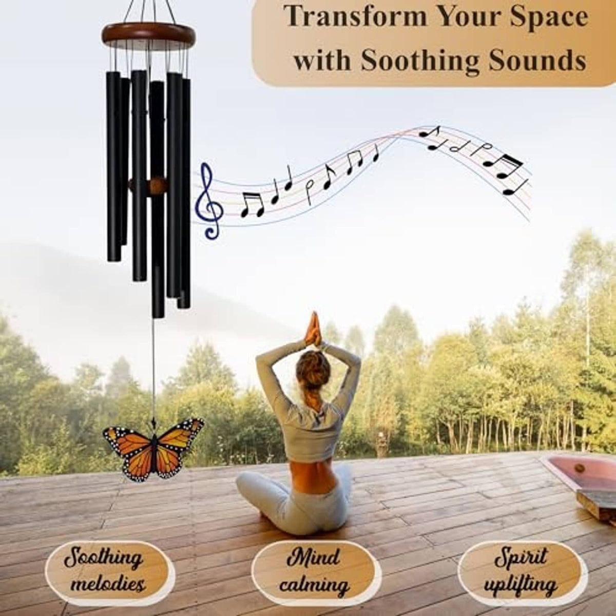 Monarch butterfly wind chime with black tubes and hanging glass butterfly pendant outdoors