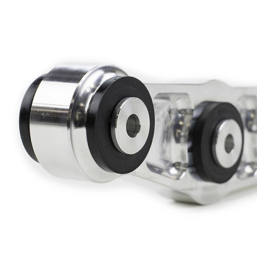 Close-up of silver control arm bushing end with black rubber insert