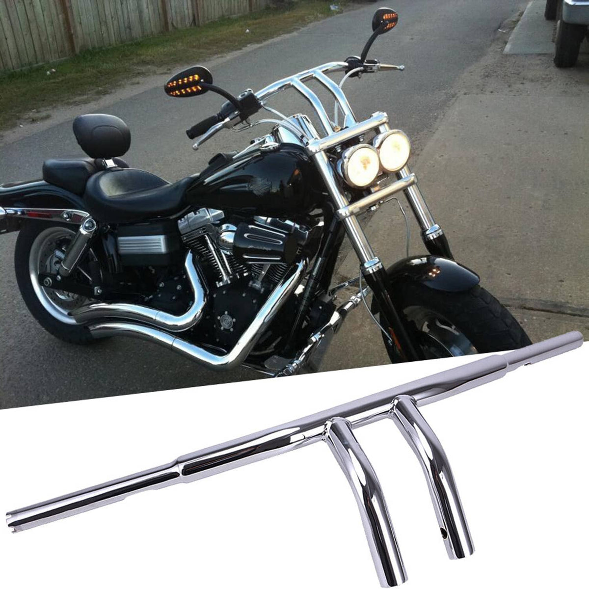 Chrome drag handlebars with T-bar risers and mounted controls on a motorcycle
