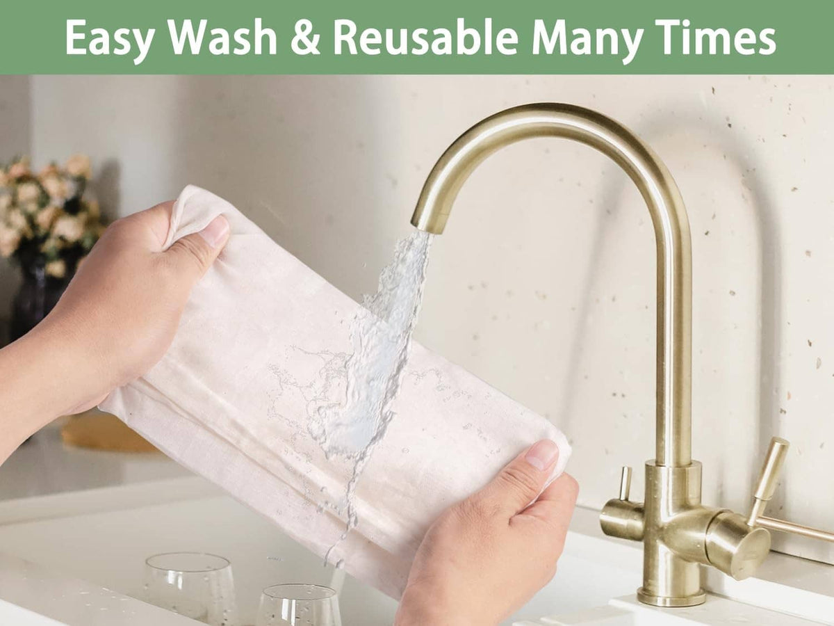 Cheesecloth sheet being rinsed under a sink faucet, reusable cotton